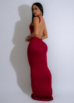 Long red dress with ruched detailing and a flattering silhouette