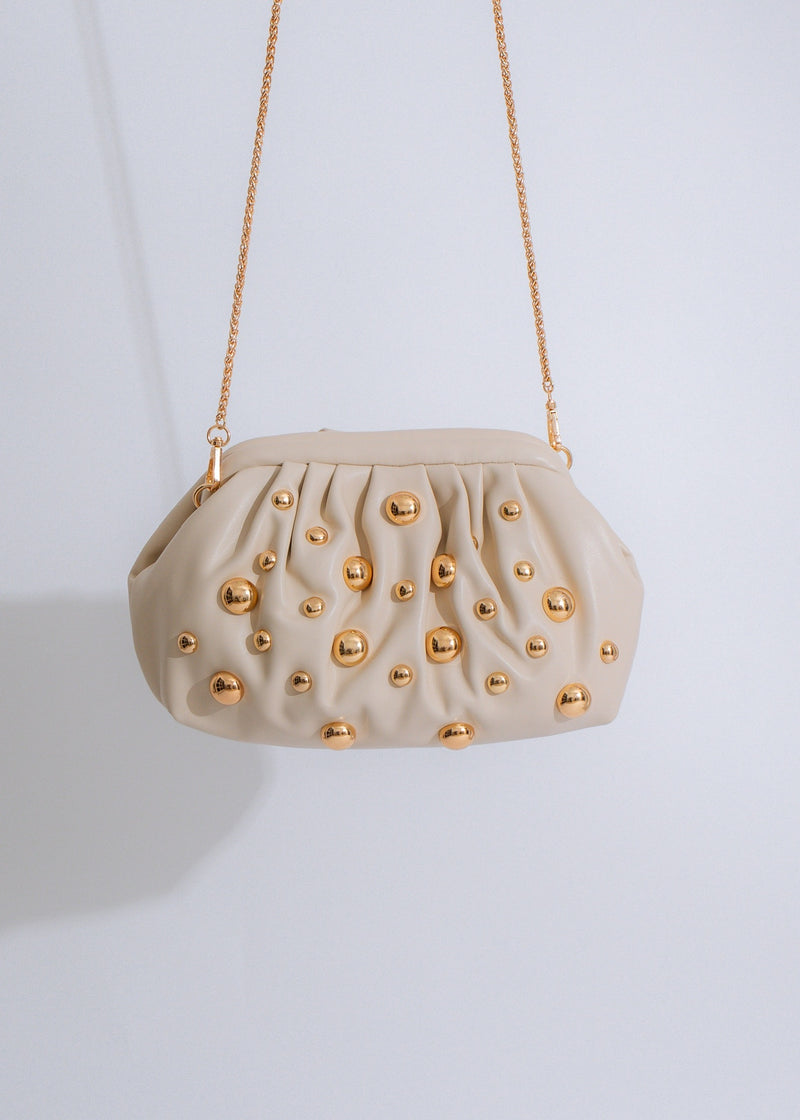 Close-up image of the Stellar Studded Clutch Nude, showcasing the intricate studded details and luxurious nude color, perfect for a night out or special occasion