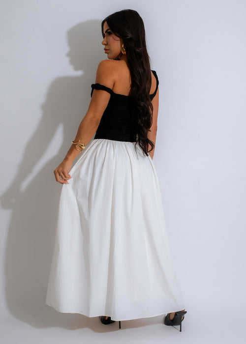  Sleeveless V-neck dress in black with a flowy, floor-length skirt