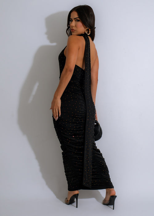 Full-length image of the Galaxy Glimmer Rhinestones Ruched Maxi Dress Black, featuring a sleek black fabric with a shimmering rhinestone embellishment and flattering ruched detailing