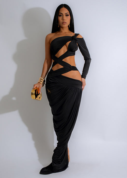 Front view of the elegant Obsidian Knot Ruched Maxi Dress in classic black, featuring a flattering ruched design and a stylish knot detail at the waist