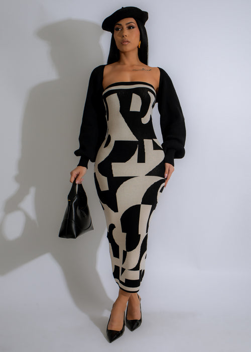 Black midi dress with graphic rhythm design, perfect for evening events