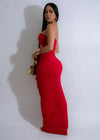 Red ruched maxi dress with serpent print, perfect for elegant evenings