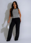 Close-up of black knit pant set with ribbed texture and drawstring waist 