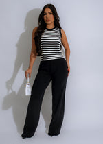 Close-up of black knit pant set with ribbed texture and drawstring waist 