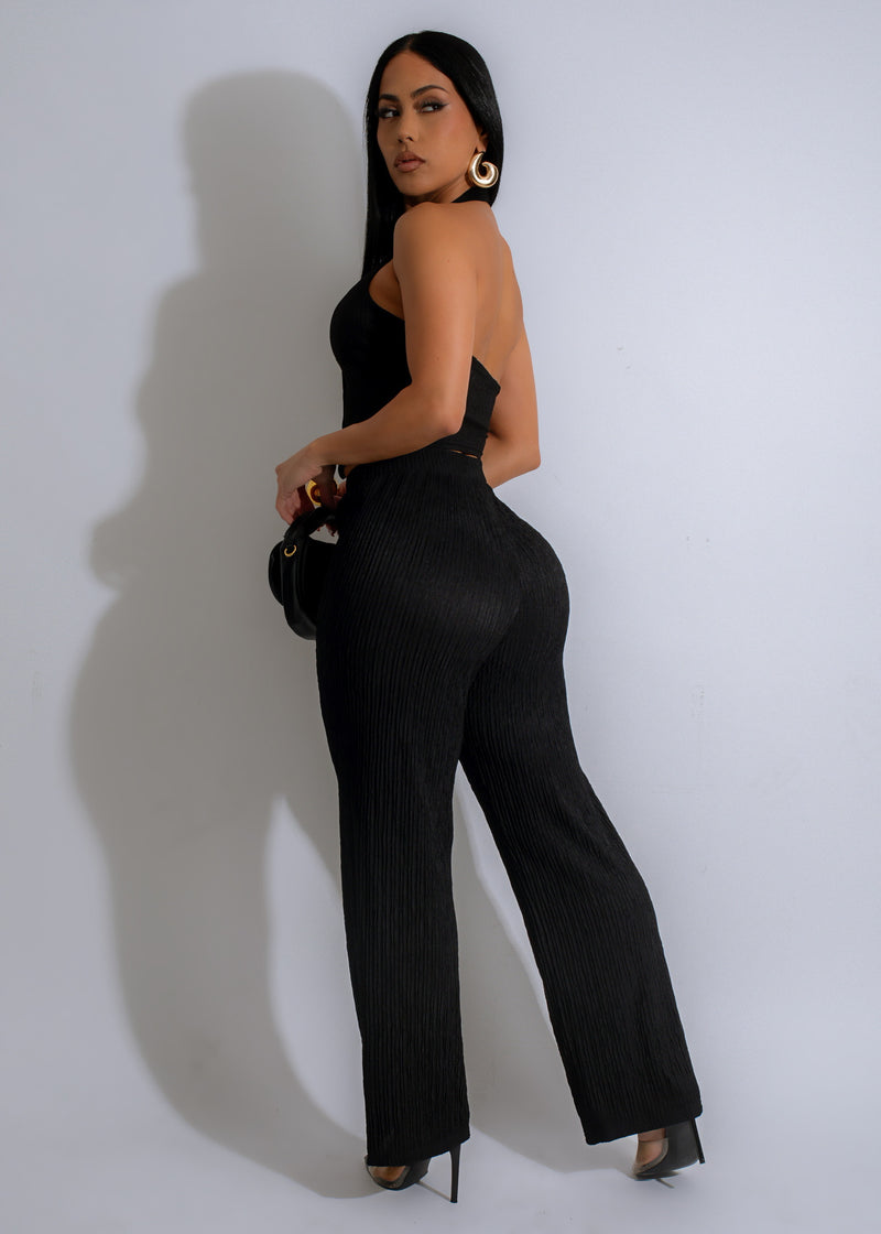  Two-piece black pant set featuring a delicate lace top and flowy, comfortable pants for a luxurious and sophisticated look