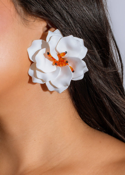 Handcrafted white tropical bloom earrings featuring delicate floral details and vibrant colors