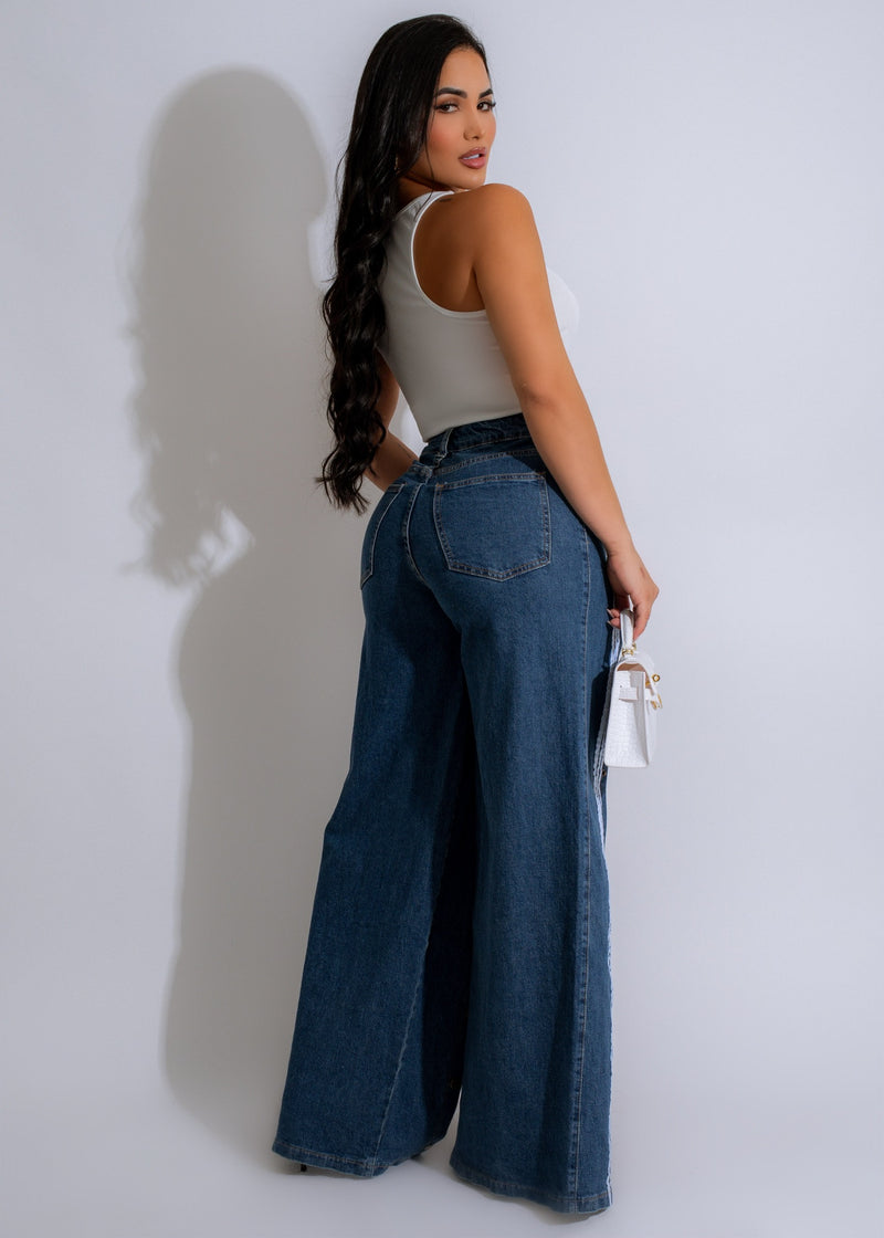  Side view of the Living In It Jeans Dark Denim showcasing the slim, flattering silhouette