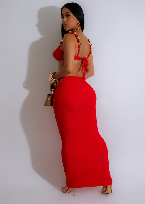  Elegant red two-piece set featuring a beaded skirt and cropped top with intricate golden details