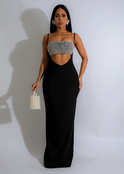 Close-up image of elegant Pearl Noir Rhinestone Maxi Dress in Black with sparkling rhinestone detailing and flowing skirt