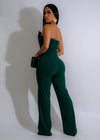 
Side view of the stunning Regal Ascent Jumpsuit Green, showcasing its wide-leg design and beautiful emerald green color This versatile and sophisticated jumpsuit is a must-have for your wardrobe, offering both comfort and style