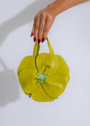 Stylish and elegant green handbag with intricate petal design