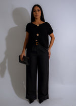 Black knit long top featuring a relaxed silhouette and a cozy feel