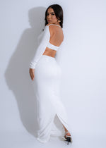 Beautiful summer dress in white with adjustable spaghetti straps and flowy skirt