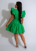 Elegant and stylish green mini dress with delicate ruffle detailing