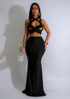 Twisted Elegance Skirt Set Black, a stylish and sophisticated outfit for any occasion, featuring a flattering black skirt and matching top with a unique twisted design
