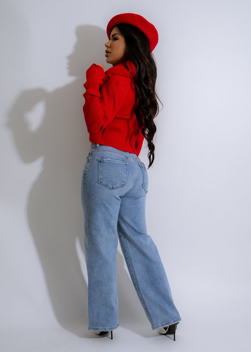 A close-up image of a Luxe Cozy Collar Ribbed Sweater in vibrant red, featuring a soft and comfortable ribbed knit and a cozy, oversized collar