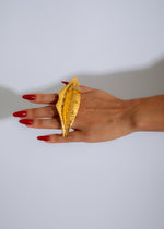 Handcrafted Solaris Lips Statement Ring in radiant gold with intricate detailing