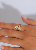 Serpentine Elegance Ring Gold with intertwining design and sparkling gemstones