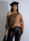 Close-up of Wild Harmony Leopard Knit Sweater in Brown, featuring a stylish leopard print design and cozy knit fabric