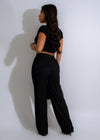 Two-piece formal wear set in black, featuring a flowing cascade pant and matching top