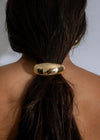 Crescent Glow Hair Tie Gold, a shimmering hair accessory for elegant hairstyles 