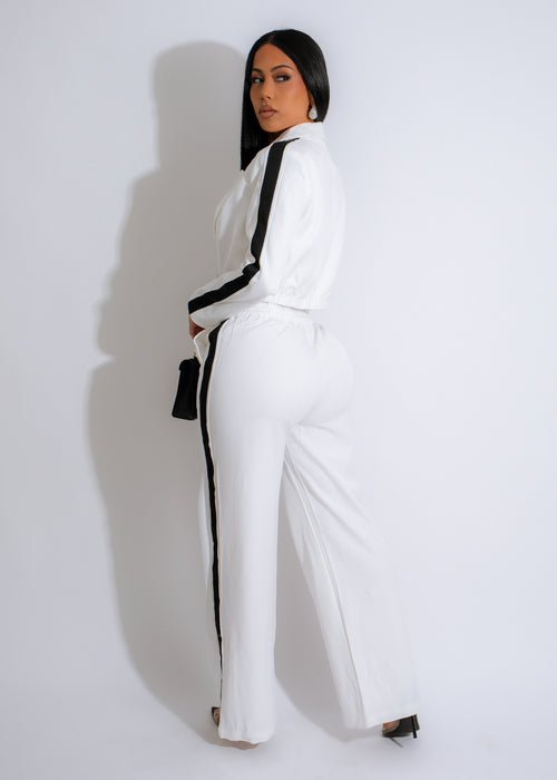 Two-piece white pant set with monochrome rhinestone detailing, perfect for a stylish and glamorous look