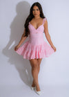 Feminine pink lace mini dress with floral details and delicate design