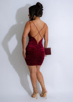  Front view of stunning red mini dress with sparkling rhinestones and flattering ruched detailing