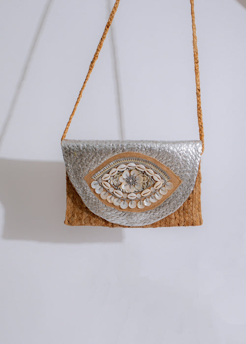 Shimmering silver handbag with woven details and adjustable strap for summer