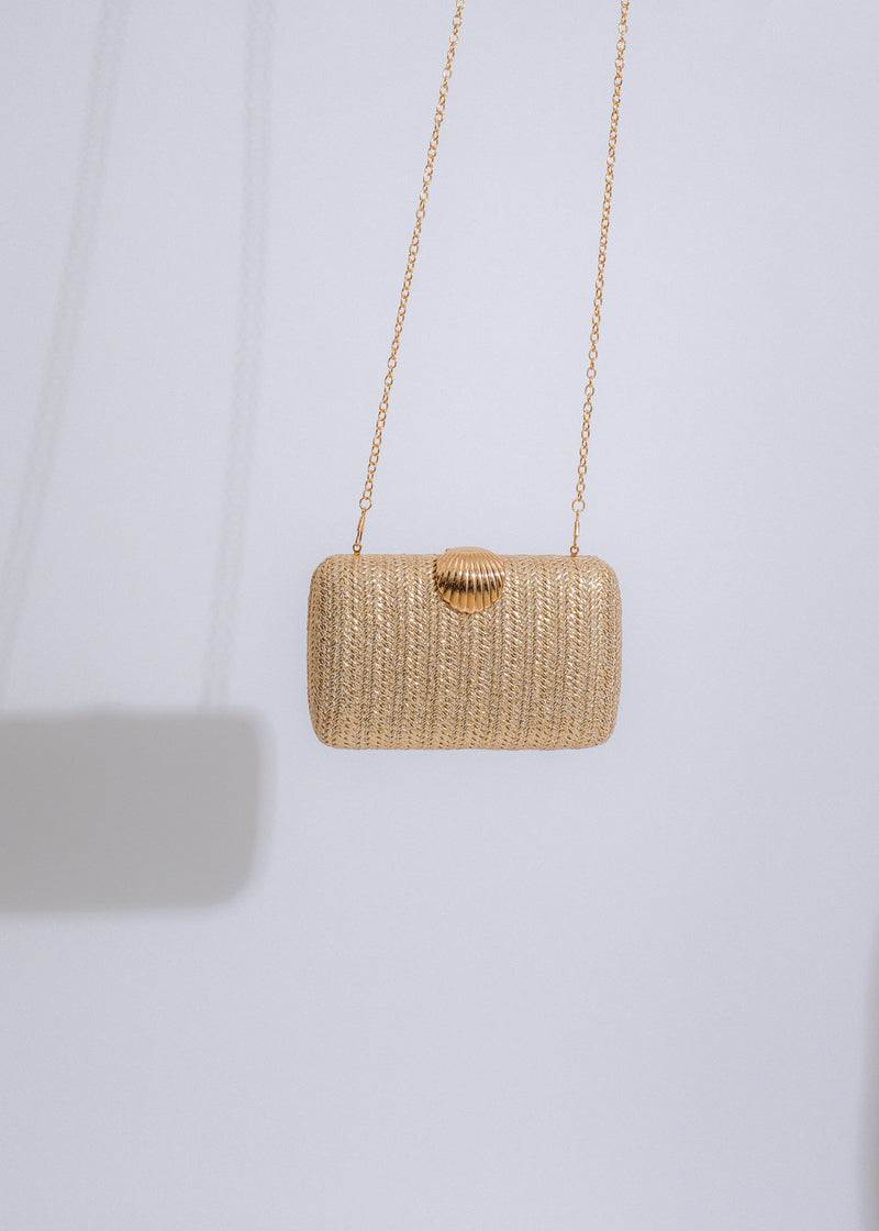 Seashell weave clutch in gold with intricate handcrafted detailing