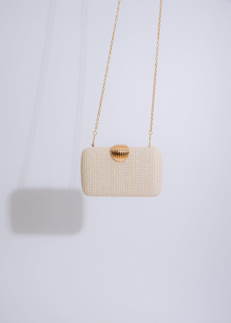 Seashell weave clutch in nude with intricate shell design and chain strap