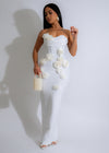 Close-up of white maxi dress with rose petal floral bandage detailing