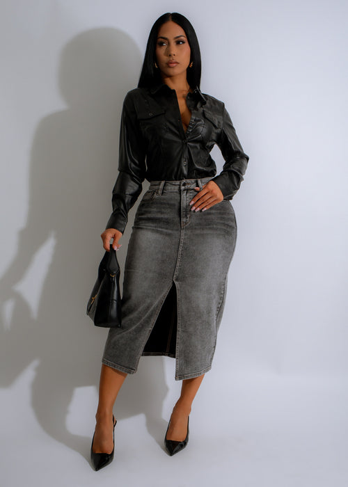 Stonewashed stunner skirt in dark denim featuring distressed detailing and a figure-flattering silhouette perfect for casual-chic looks