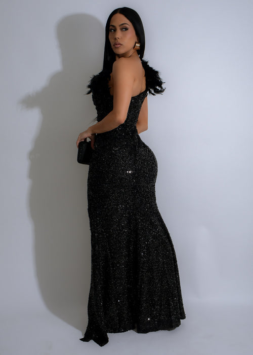 Elegant black sequin maxi dress with feather-like embellishments from the back view