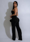  Full-length view of black rhinestone jumpsuit with elegant design and shimmering embellishments