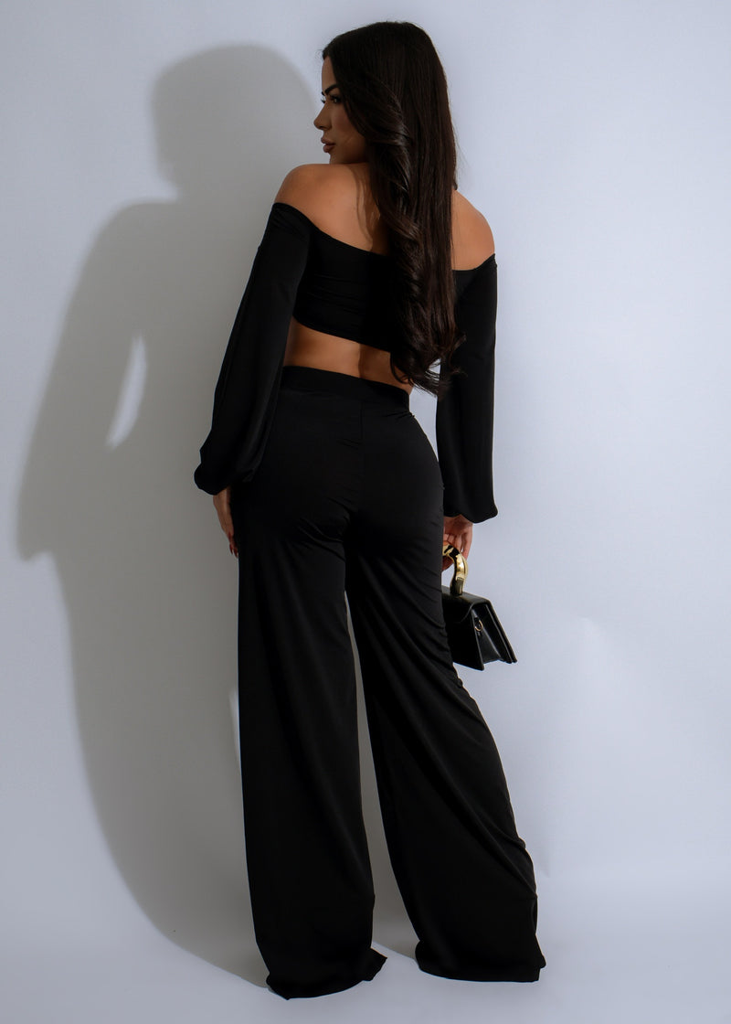 Elegant and sophisticated black Sunset Serenade Pant Set featuring a loose-fitting top and wide-leg pants, ideal for formal events or date nights