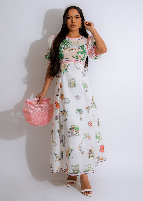 Alt text: Beautiful white maxi dress with island mural print, perfect for summer vacations and beach getaways