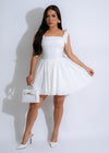 Beautiful white mini dress with delicate lace detailing by Ember Grace