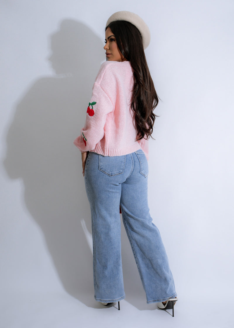 A cozy and stylish Cherry Delight Knit Sweater in a lovely pink color