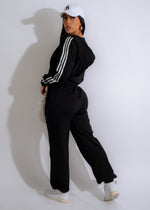 Black urban stride tracksuit with zip-up jacket and matching pants