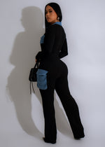 Black cargo jumpsuit with multiple pockets and adjustable waist tie detail