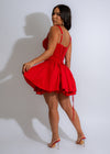 Red lace mini dress with delicate charm detailing and a breezy silhouette