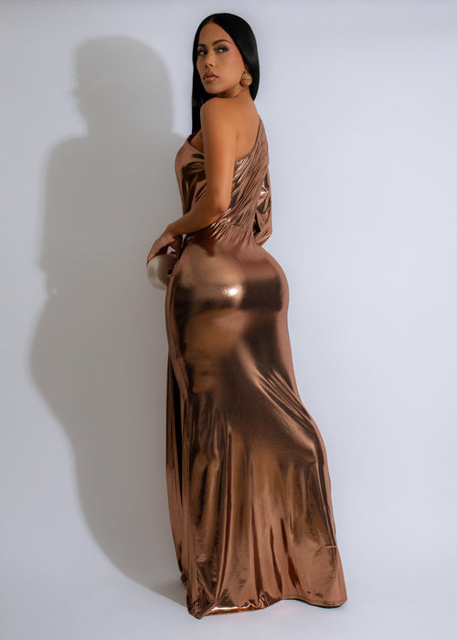 Shimmery gold maxi dress with metallic ruched detailing and a gilded glow