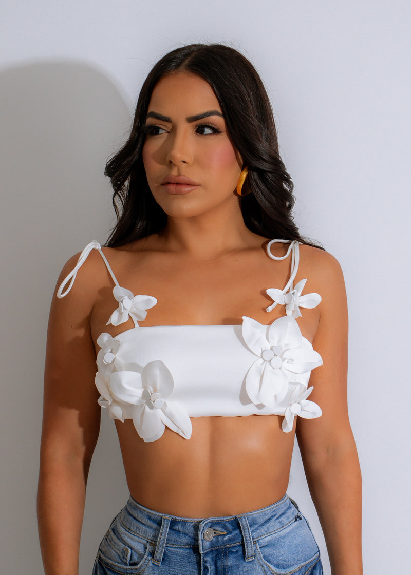 The luxurious satin fabric of the Petal Bloom Satin Crop Top White in flowing motion