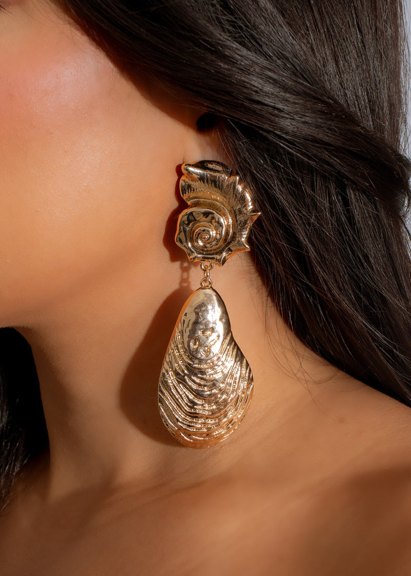 Shimmering gold Oceanic Glam Earrings with intricate ocean-inspired design and stunning details