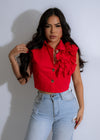 Vibrant red Rouge Reverie Ruffle Top with flirty ruffles and a flattering silhouette