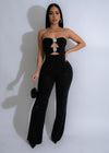 Close-up of black rhinestone jumpsuit with intricate detailing and sparkles