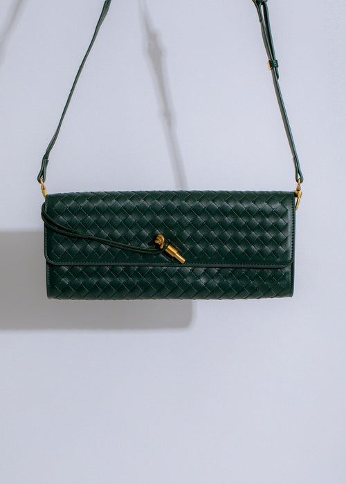  Beautifully crafted green handbag with woven patterns and leather straps