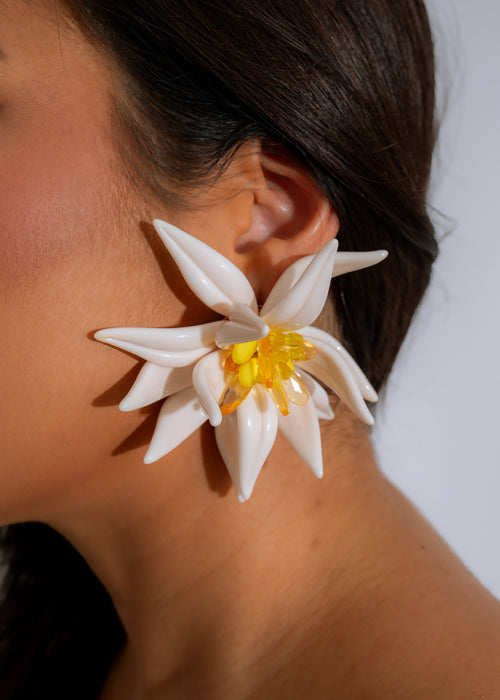 Beautiful white Blossom Radiance Earrings with intricate floral design and sparkling gems